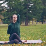 일상 속 ‘작은 변화’가 만드는 큰 차이, 실천하는 정신건강 루틴 Woman practicing yoga on mat in park