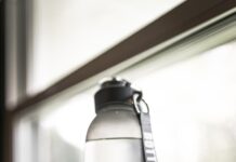 “끝나지 않는 피로감, 생활 속 작지만 확실한 변화로 극복하세요” person holding gray and black tumbler