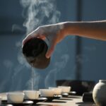 대체요법의 진화, 웰빙 시대에 각광받는 새로운 건강 관리 트렌드 person pouring hot water on white cup
